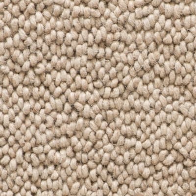 Close-up look at Risco, a straw-coloured carpet from the Coco range. Its high and densely packed loop piles make it soft under foot.