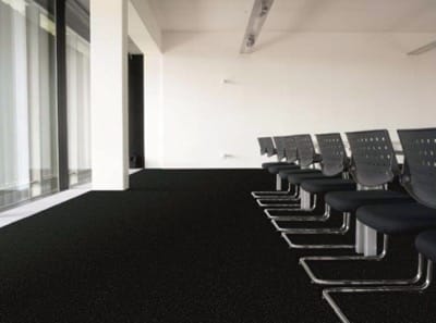 A conference room with the Ocean Channel carpet, from the Needlepunch Marine range.
